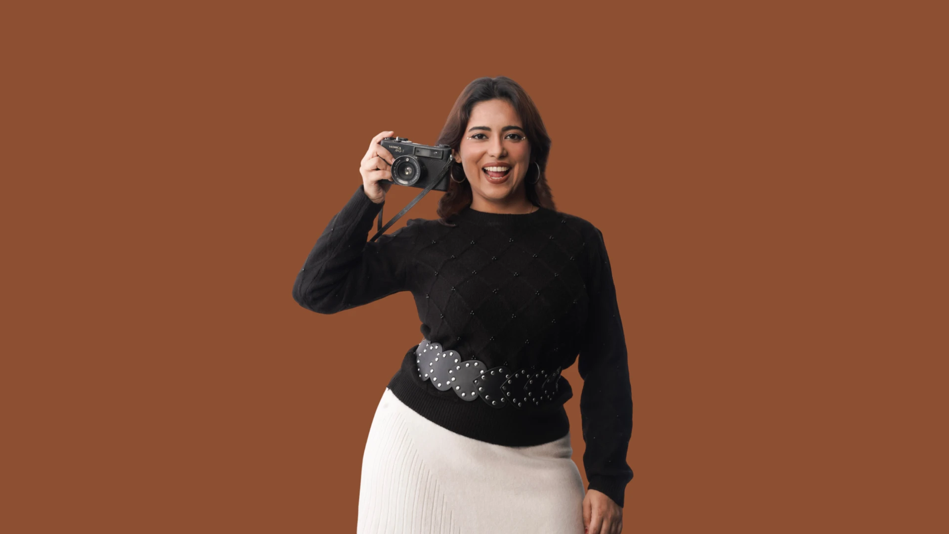 Astha Chawla holding a vintage film camera